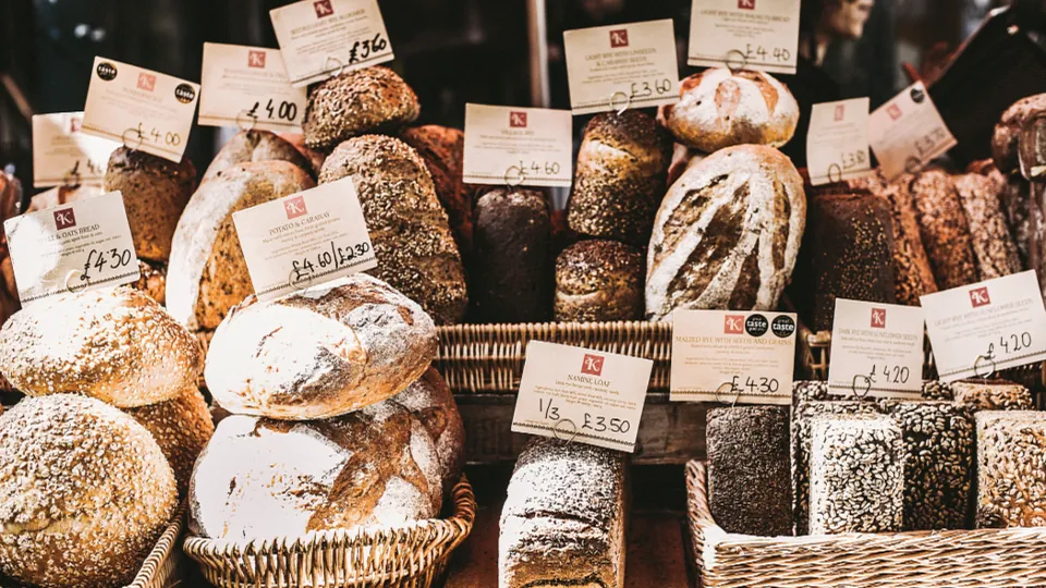 Freshly baked loaves of bread on display in a bakery