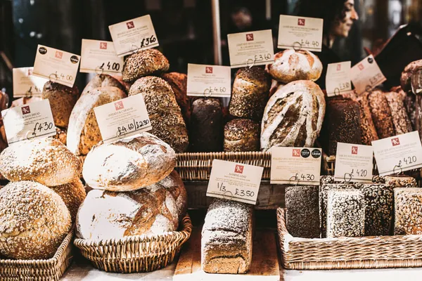 Freshly baked loaves of bread on display in a bakery