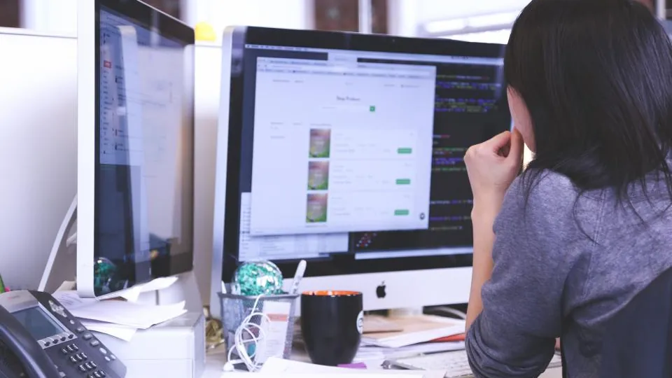 Web designer working at two screens