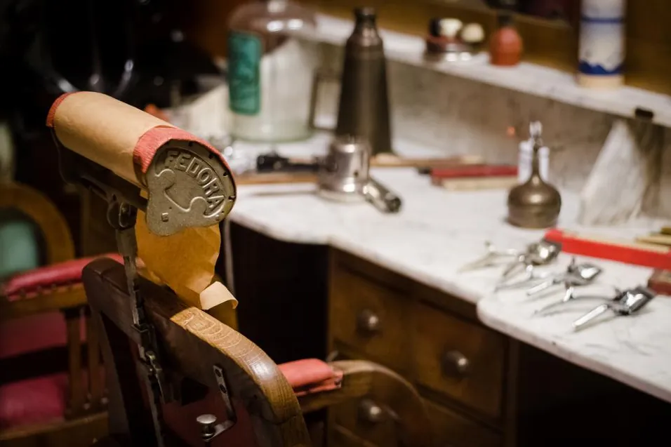 Vintage barber chair and tools in a traditional barbershop