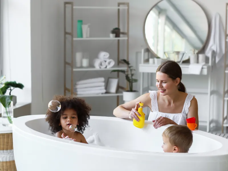 Freestanding bath in a bright family bathroom