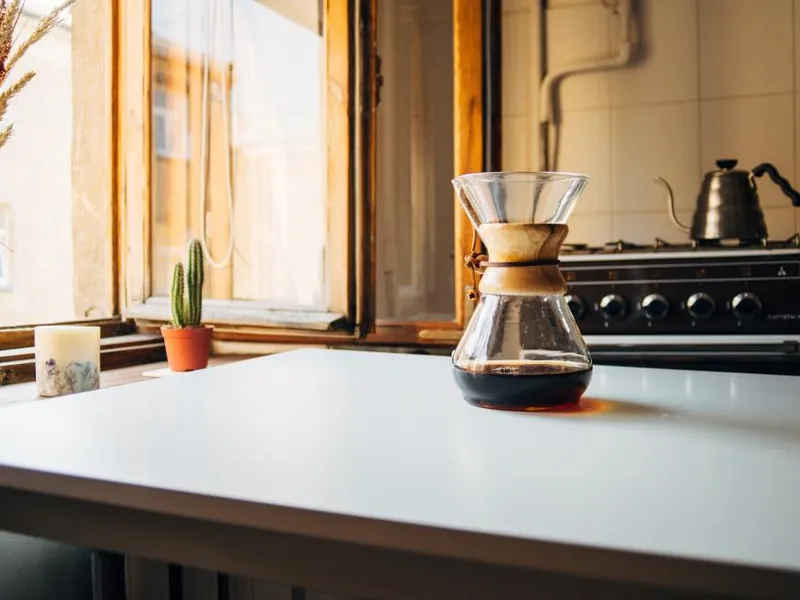 Sunlit kitchen worktop with a coffee maker