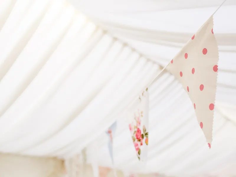 Marquee ceiling decorated with bunting