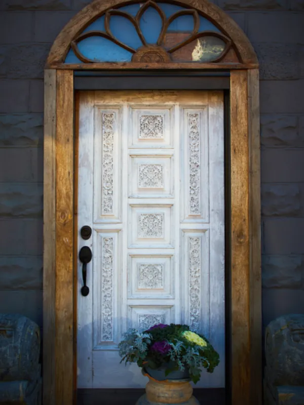 Traditional front door with an arched fanlight